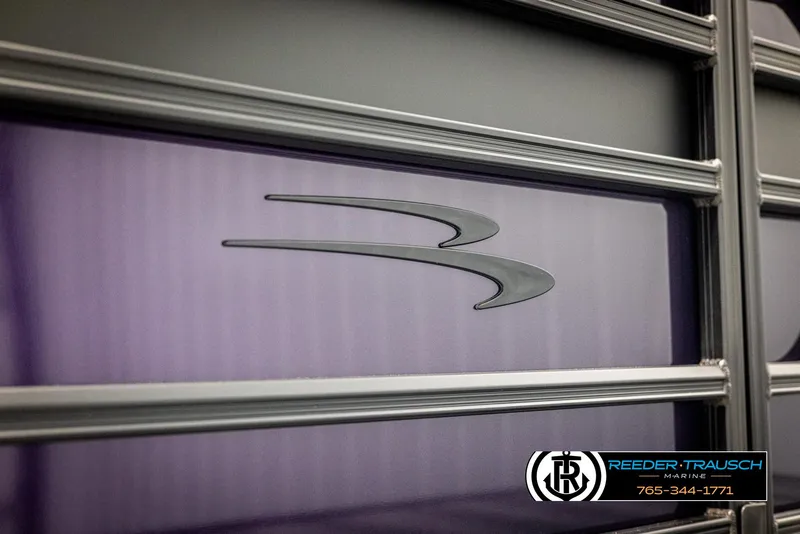 Slide: The Image of 2025 Bennington 23 SSBSE boat with sleek design and logo detail. - 45