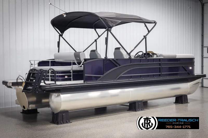 Slide: The Image of 2025 Bennington 23 SSBSE pontoon boat with canopy in showroom. - 6