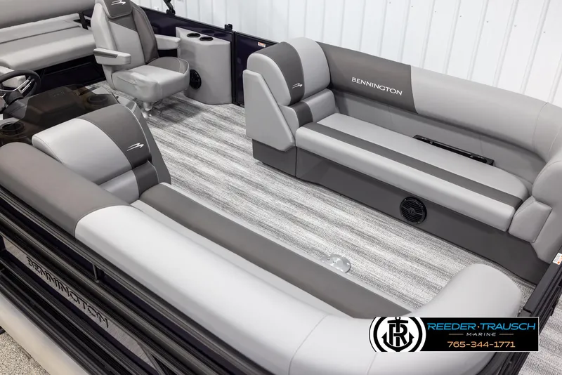 Slide: The Image of 2025 Bennington 23 SSBSE pontoon boat interior with gray seating and striped flooring. - 9