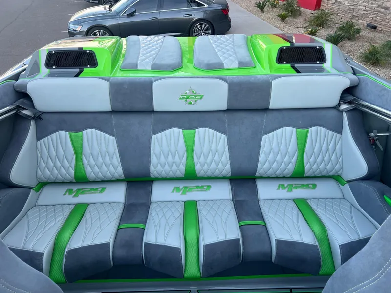 Slide: The Image of 2015 Daves Custom Boats M-29 interior with green and gray seating. - 10
