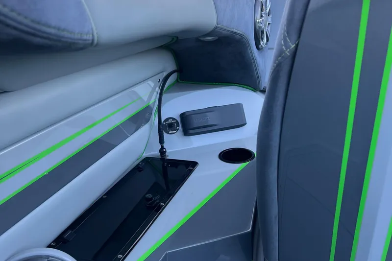 Slide: The Image of Interior of 2015 Daves Custom Boats M-29 with sleek design and green accents. - 11