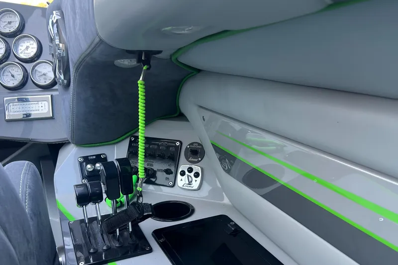 Slide: The Image of Interior of 2015 Daves Custom Boats M-29 with control panel and gauges. - 12