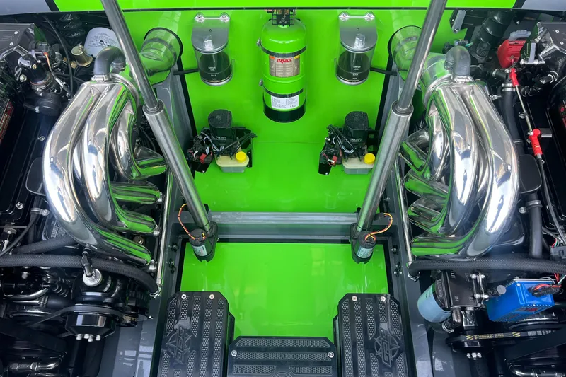 Slide: The Image of 2015 Daves Custom Boats M-29 engine bay with vibrant green accents and chrome components. - 15