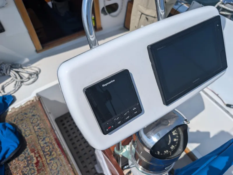 Slide: The Image of Hinckley Bermuda 40 Yawl 1974 cockpit with navigation instruments and compass. - 16