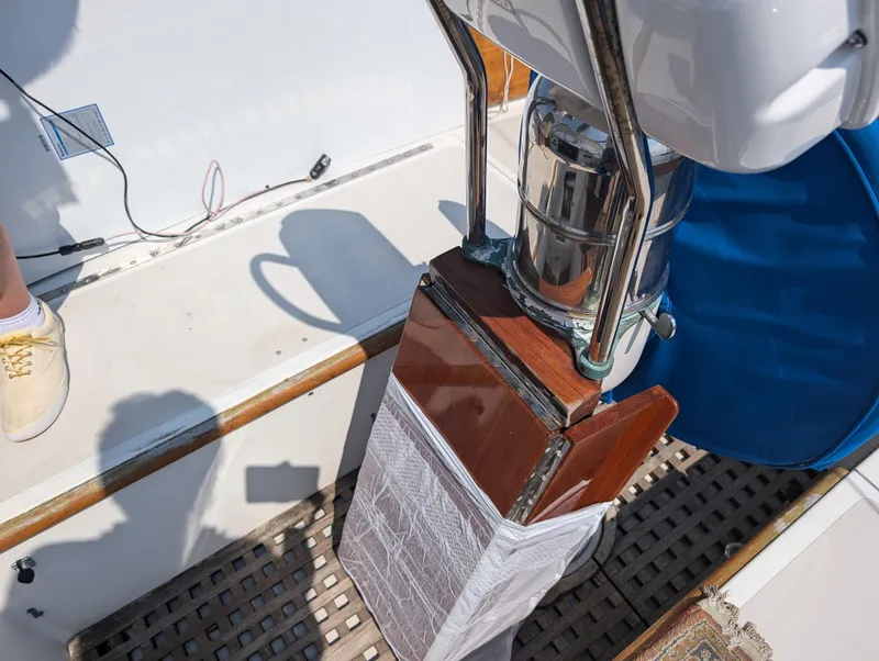 Slide: The Image of Hinckley Bermuda 40 Yawl 1974 cockpit detail with steering wheel and wooden accents. - 21
