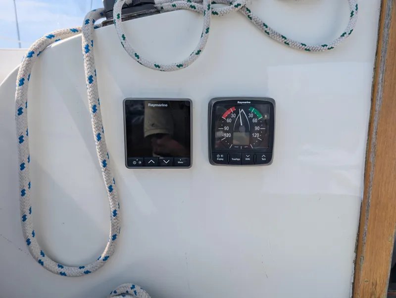 Slide: The Image of Hinckley Bermuda 40 Yawl 1974 cockpit instruments with ropes and navigation displays. - 24