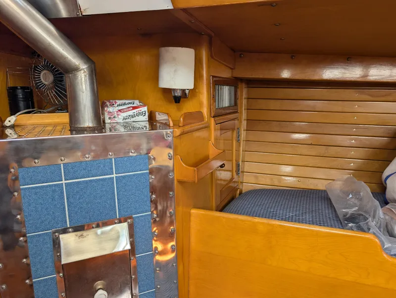 Slide: The Image of Interior of 1974 Hinckley Bermuda 40 Yawl with wood paneling and stove. - 27