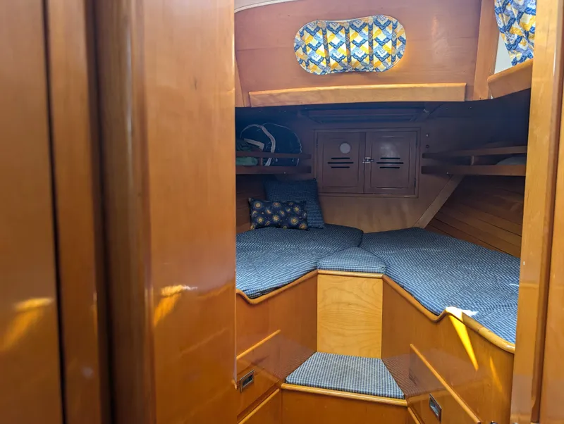 Slide: The Image of Interior cabin of 1974 Hinckley Bermuda 40 Yawl with wooden finish and cozy bedding. - 32