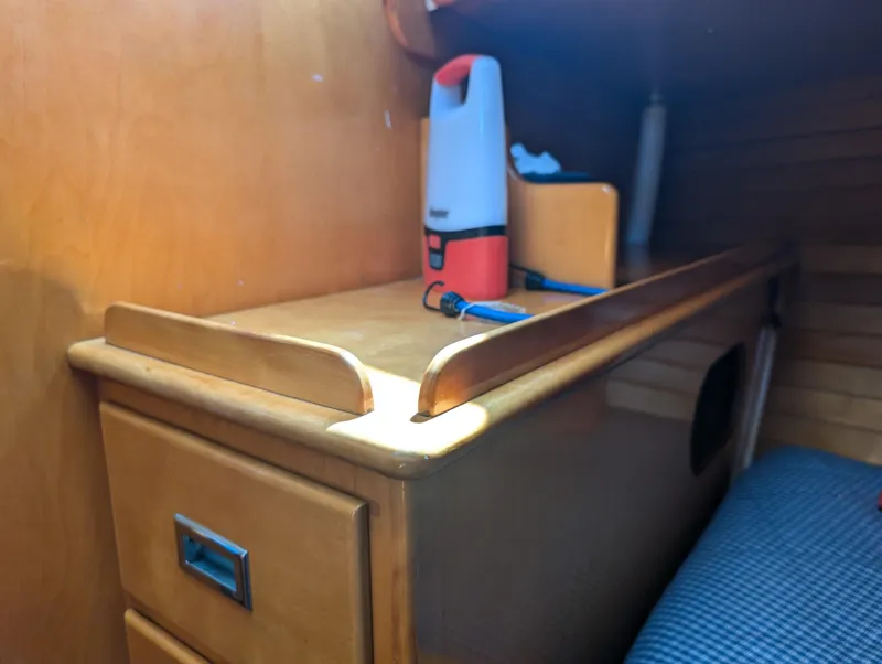 Slide: The Image of Interior of 1974 Hinckley Bermuda 40 Yawl with wooden cabinetry and storage. - 35