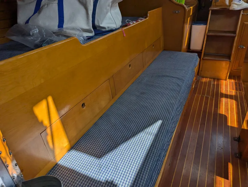 Slide: The Image of Interior of 1974 Hinckley Bermuda 40 Yawl with wooden seating and storage. - 39