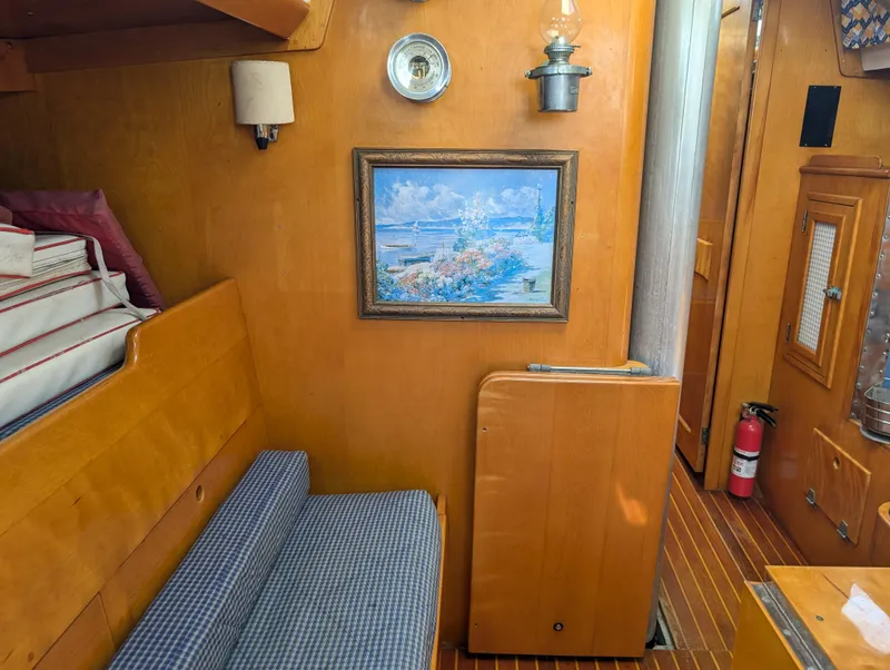 Slide: The Image of Interior of 1974 Hinckley Bermuda 40 Yawl with wood paneling and nautical decor. - 45