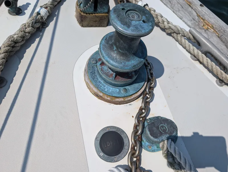 Slide: The Image of Close-up of a 1974 Hinckley Bermuda 40 Yawl deck winch and chain. - 5