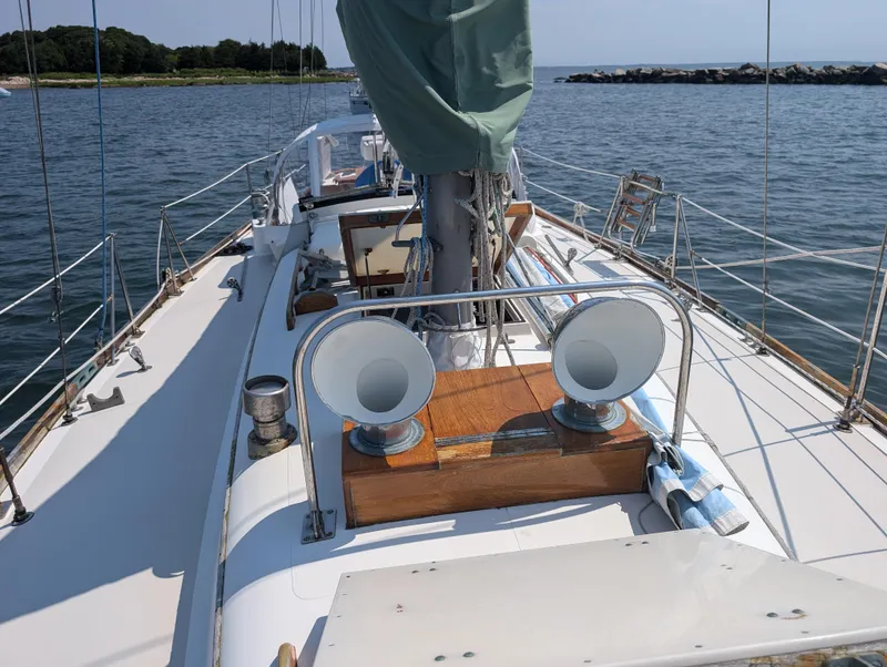 Slide: The Image of 1974 Hinckley Bermuda 40 Yawl sailboat on calm water, deck view. - 9
