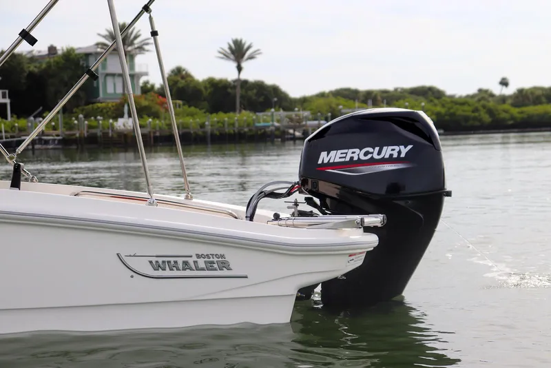 Slide: The Image of 2024 Boston Whaler 160 Super Sport with Mercury engine on calm water. - 20