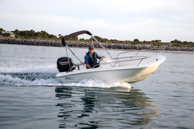 Slide: The Image of 2024 Boston Whaler 160 Super Sport cruising on water, showcasing sleek design and performance. - 22