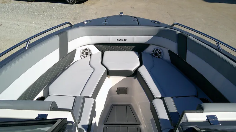 Slide: The Image of 2025 Chaparral 2870 SSX boat interior with gray seating and speakers. - 11