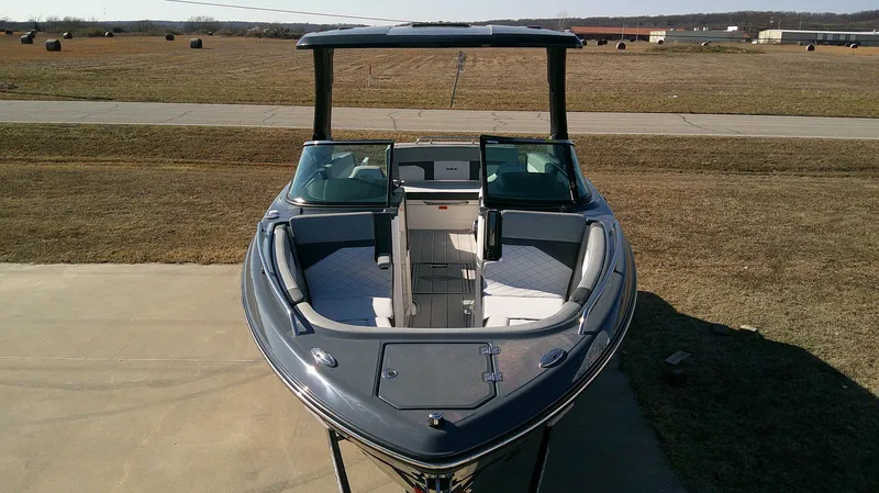 Slide: The Image of 2025 Chaparral 2870 SSX boat on a concrete surface, front view. - 3