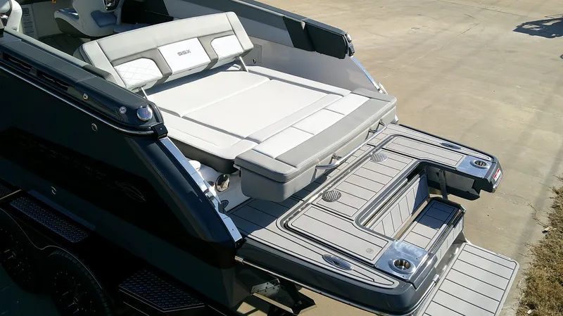 Slide: The Image of 2025 Chaparral 2870 SSX boat with spacious rear deck and seating area. - 5