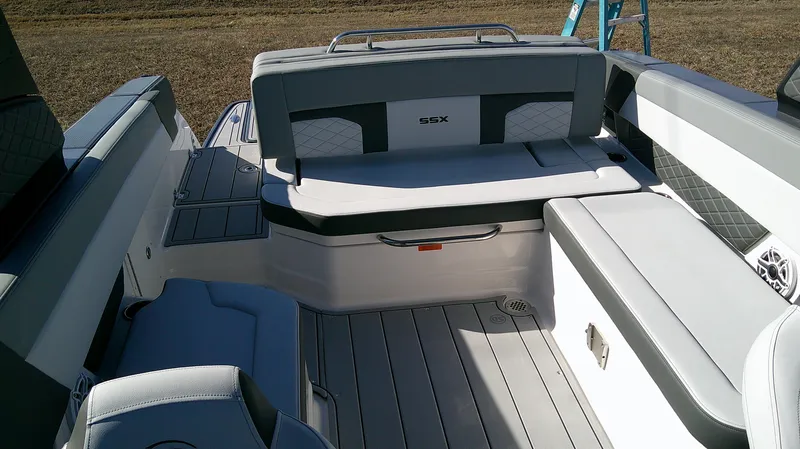 Slide: The Image of 2025 Chaparral 2870 SSX boat interior with gray seating and deck. - 6