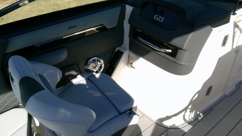 Slide: The Image of 2025 Chaparral 2870 SSX boat interior with modern seating and dashboard. - 9