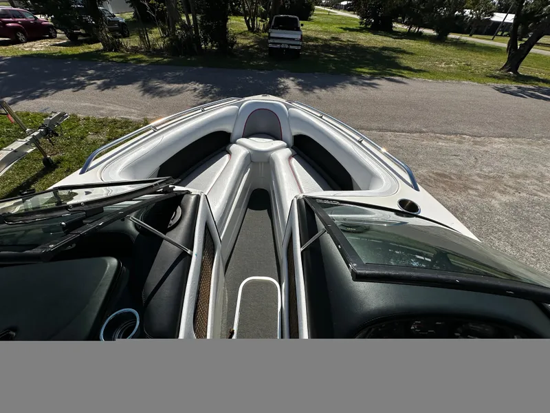 Slide: The Image of 2002 Malibu Wakesetter XTi boat interior, featuring sleek seating and dashboard design. - 10