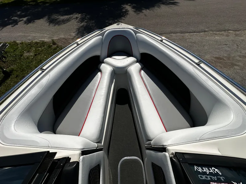 Slide: The Image of 2002 Malibu Wakesetter XTi boat interior with white and gray seating. - 11