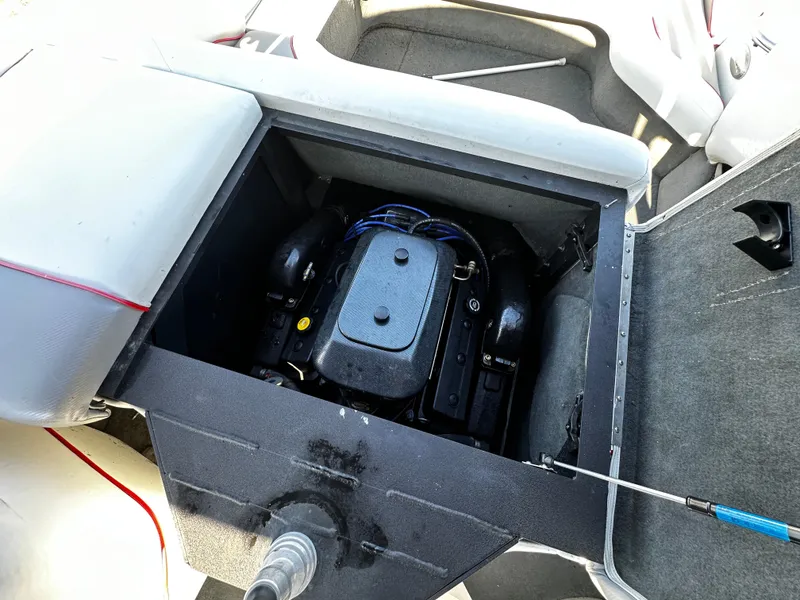 Slide: The Image of 2002 Malibu Wakesetter XTi engine compartment with visible engine components. - 12