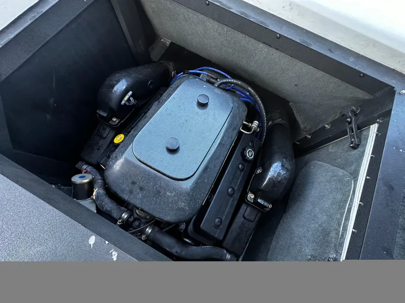 Slide: The Image of 2002 Malibu Wakesetter XTi engine compartment with visible components. - 13