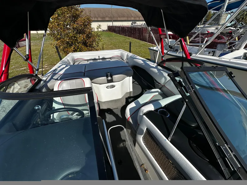 Slide: The Image of 2002 Malibu Wakesetter XTi boat interior with seating and canopy. - 15