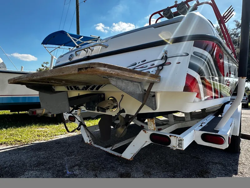 Slide: The Image of 2002 Malibu Wakesetter XTi boat on trailer, rear view, sunny day. - 8
