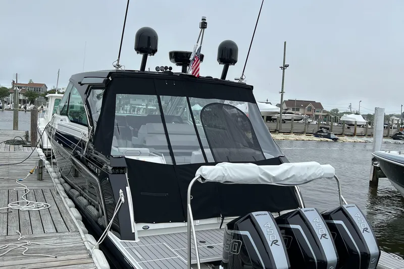 Slide: The Image of 2022 Formula 380 Super Sport Crossover OB docked with triple outboard engines. - 3