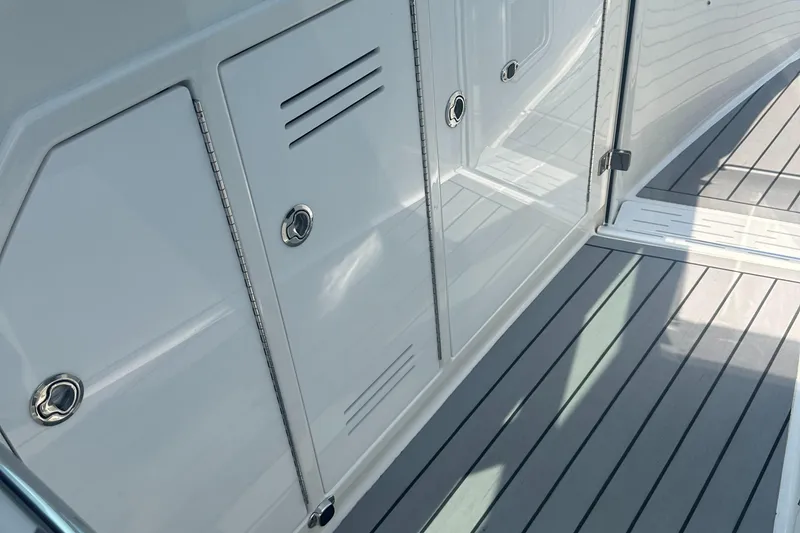 Slide: The Image of 2022 Formula 380 Super Sport Crossover OB deck with sleek storage compartments. - 6