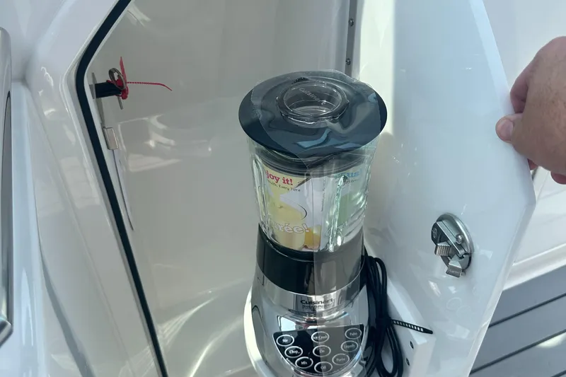 Slide: The Image of Blender stored in a cabinet on a 2022 Formula 380 Super Sport Crossover OB boat. - 7