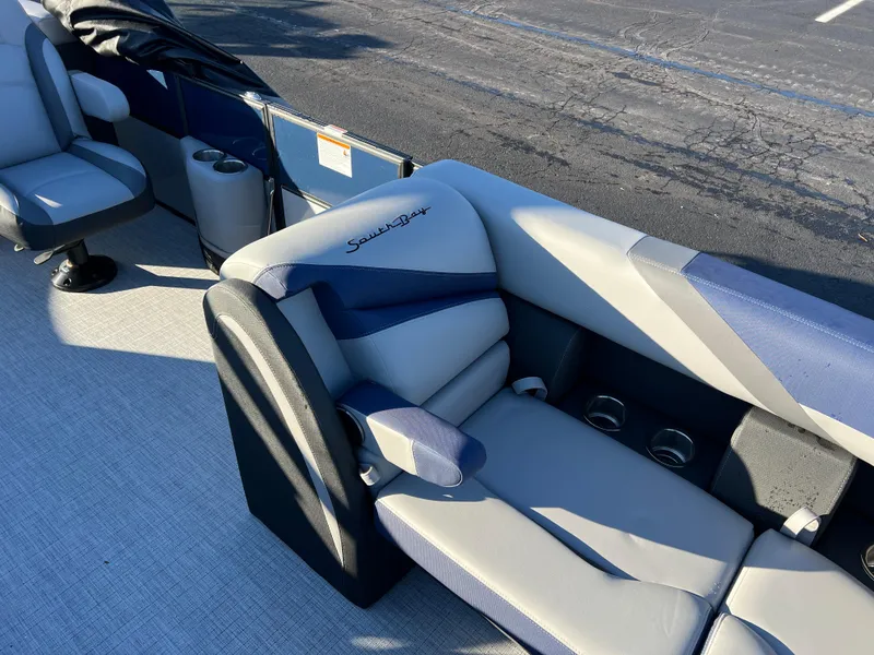 Slide: The Image of 2025 South Bay 224 RS Performance Package boat interior with plush seating. - 10