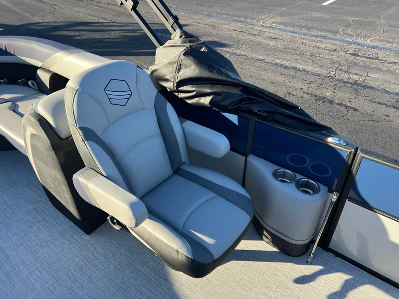 Slide: The Image of 2025 South Bay 224 RS Performance Package boat seat with cup holders. - 12