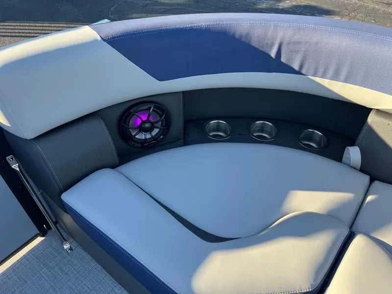 Slide: The Image of 2025 South Bay 224 RS boat interior with cushioned seating and speaker system. - 14