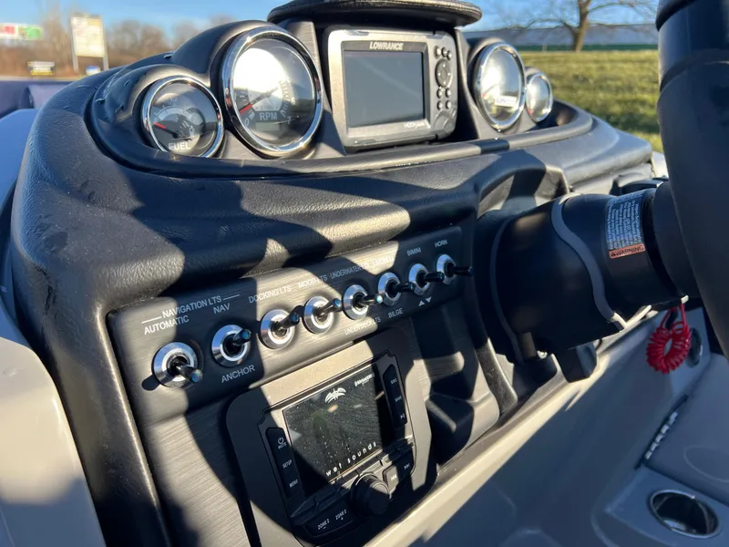 Slide: The Image of 2025 South Bay 224 RS Performance boat dashboard with gauges and controls. - 18