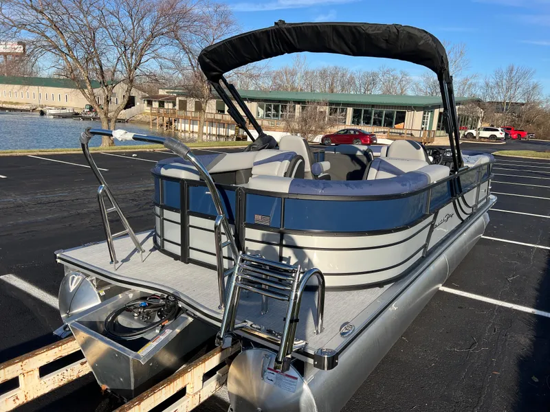 Slide: The Image of 2025 South Bay 224 RS Performance pontoon boat in parking lot, sunny day. - 5