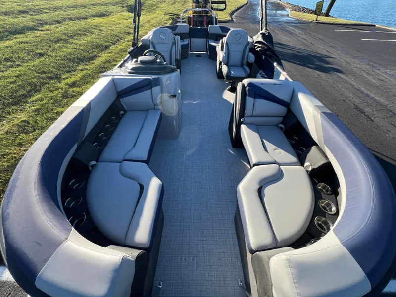 Slide: The Image of 2025 South Bay 224 RS Performance Package pontoon boat with spacious seating and modern design. - 7