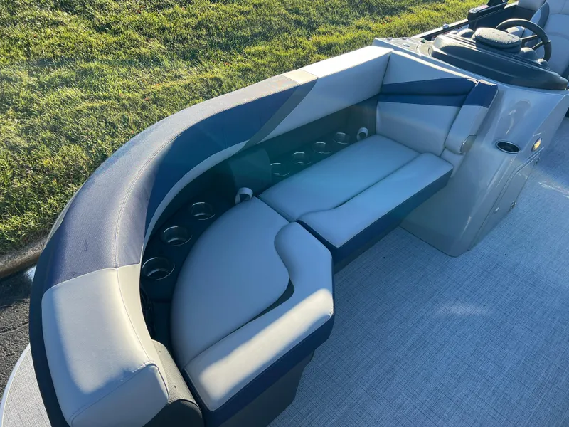 Slide: The Image of 2025 South Bay 224 RS Performance Package boat interior with plush seating. - 8
