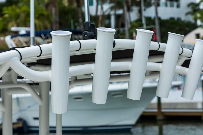 Slide: The Image of Close-up of 2025 Boston Whaler 190 Montauk rod holders at marina. - 16