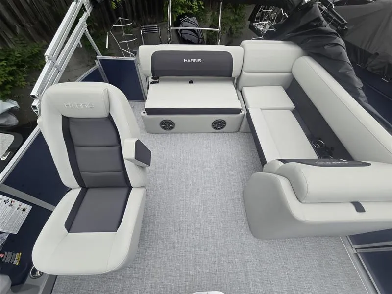 Slide: The Image of 2025 Harris Cruiser 230 boat interior with plush seating and modern design. - 4