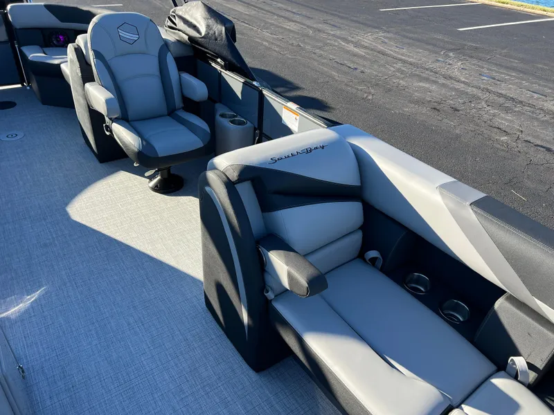 Slide: The Image of 2025 South Bay 222 RS boat interior with gray seating and modern design. - 10