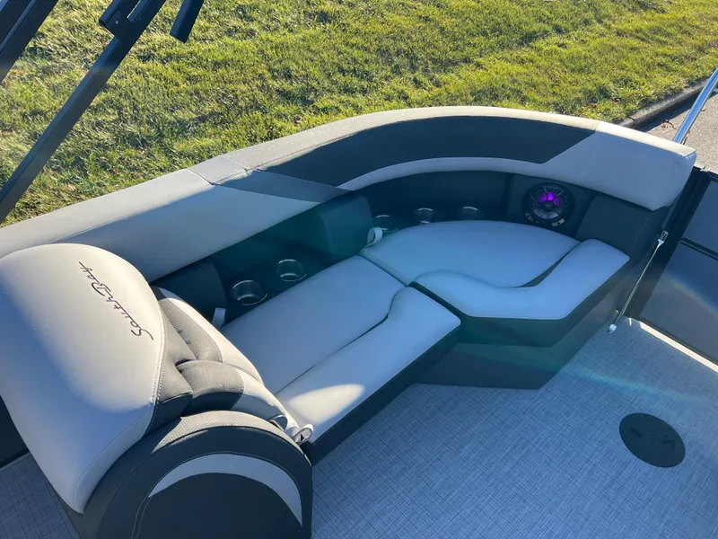 Slide: The Image of 2025 South Bay 222 RS boat interior with gray seating and cup holders. - 14