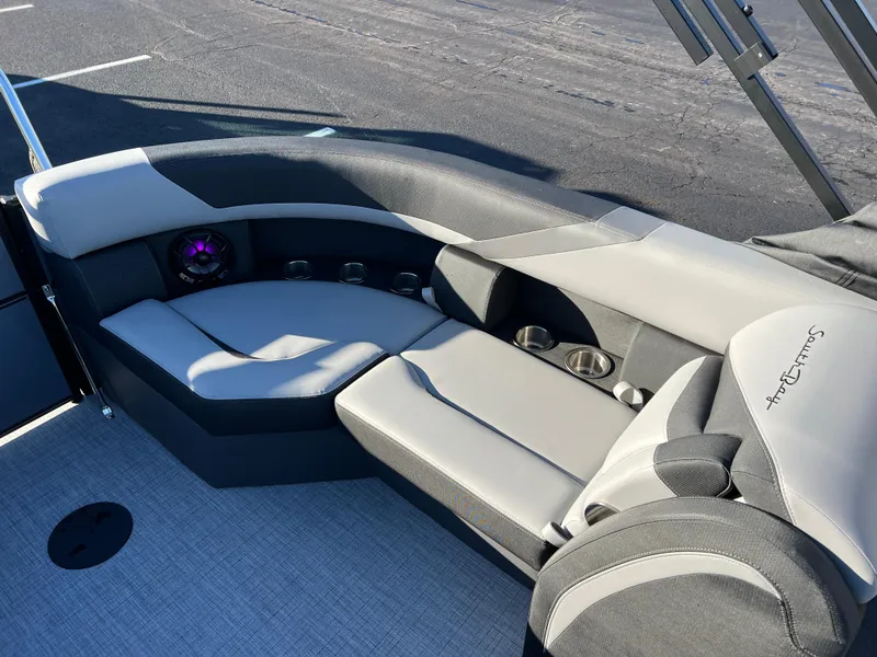 Slide: The Image of 2025 South Bay 222 RS boat interior with plush seating and cup holders. - 15