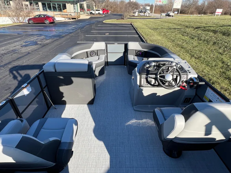 Slide: The Image of 2025 South Bay 222 RS pontoon boat interior with modern seating and steering console. - 18