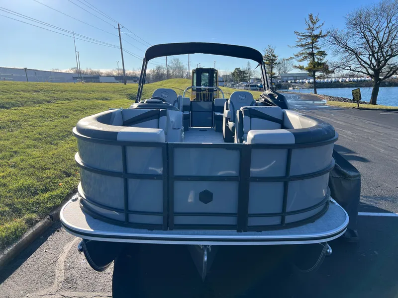 Slide: The Image of 2025 South Bay 222 RS pontoon boat parked near a lake on a sunny day. - 3