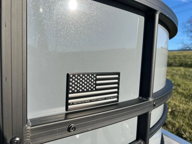 Slide: The Image of 2025 South Bay 222 RS boat with American flag emblem, sunny day. - 7