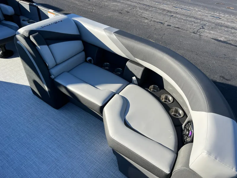 Slide: The Image of 2025 South Bay 222 RS boat interior with gray seating and cup holders. - 9