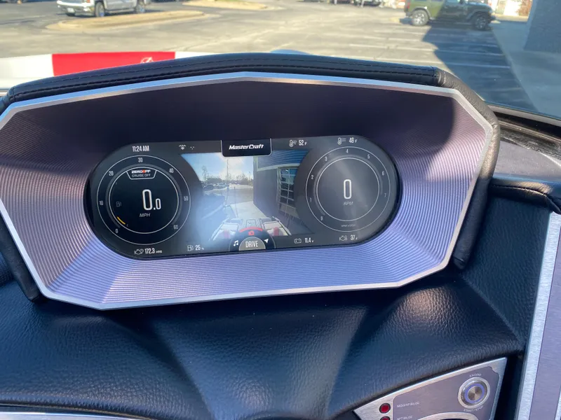 Slide: The Image of 2021 MasterCraft X26 dashboard display with digital gauges and rearview camera. - 27